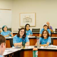 Campers smile in their class before their celebration party.